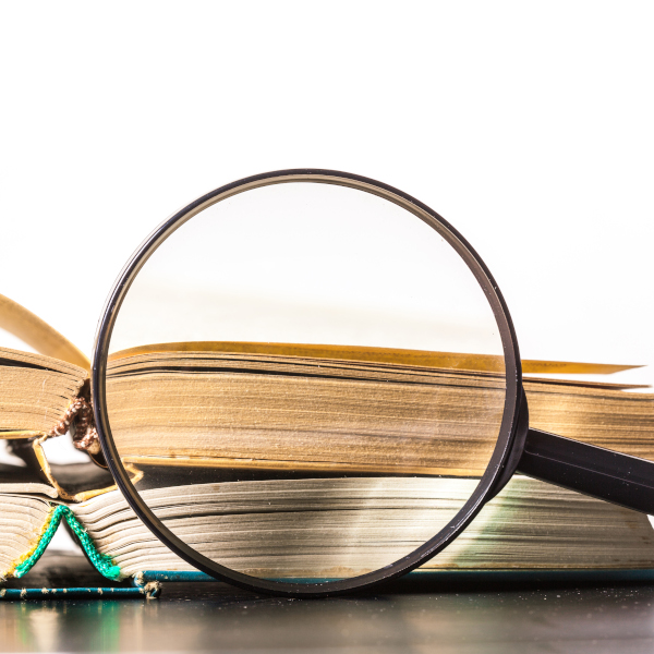 books and magnifying glass books and magnifying glass